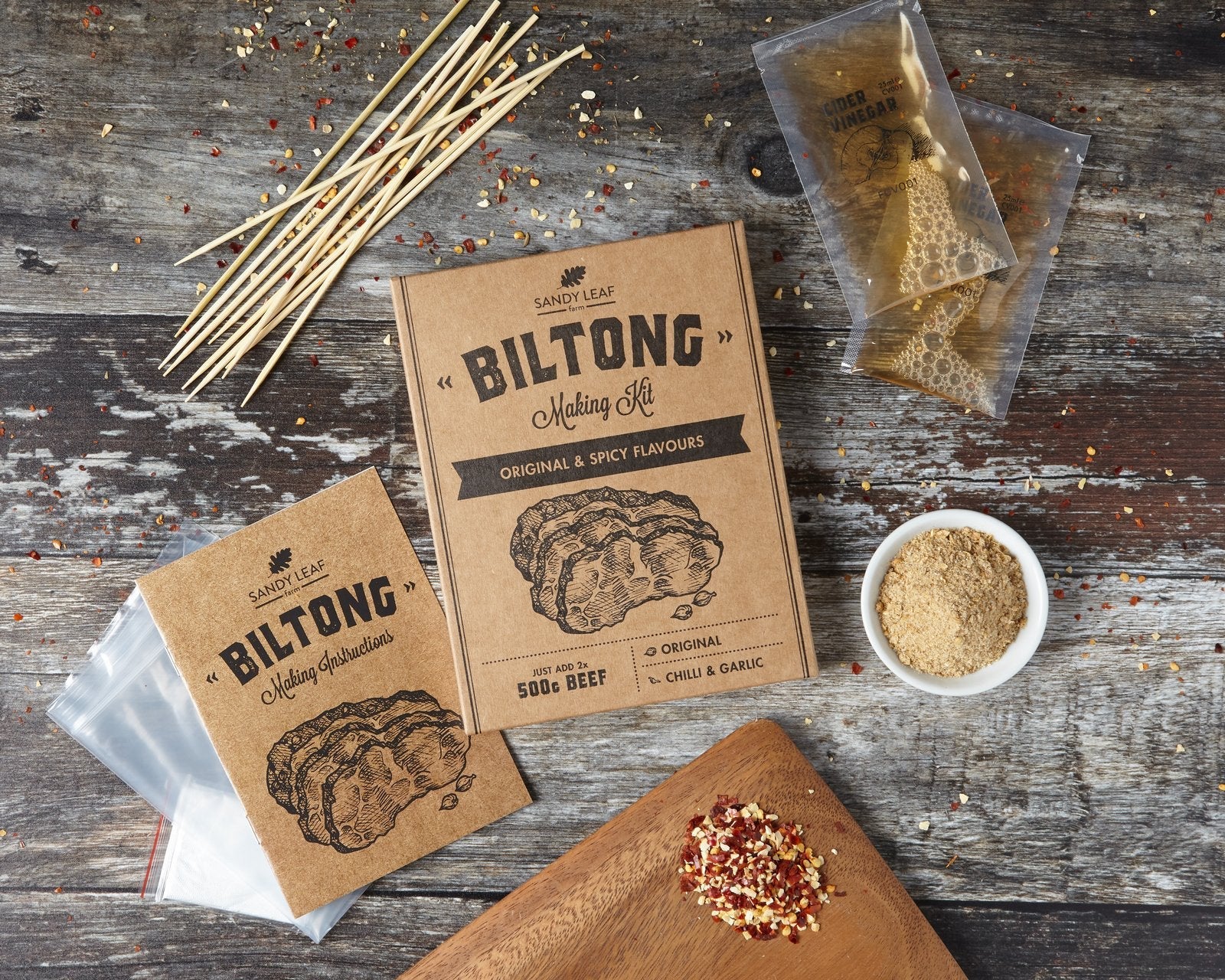 Homemade biltong strips made with a biltong making kit, seasoned with coriander and black pepper
