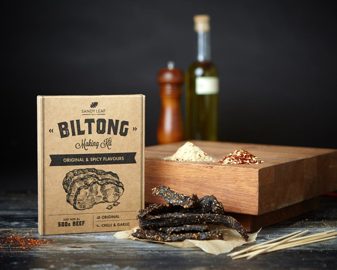 Biltong vs jerky comparison with homemade biltong and beef jerky strips side by side