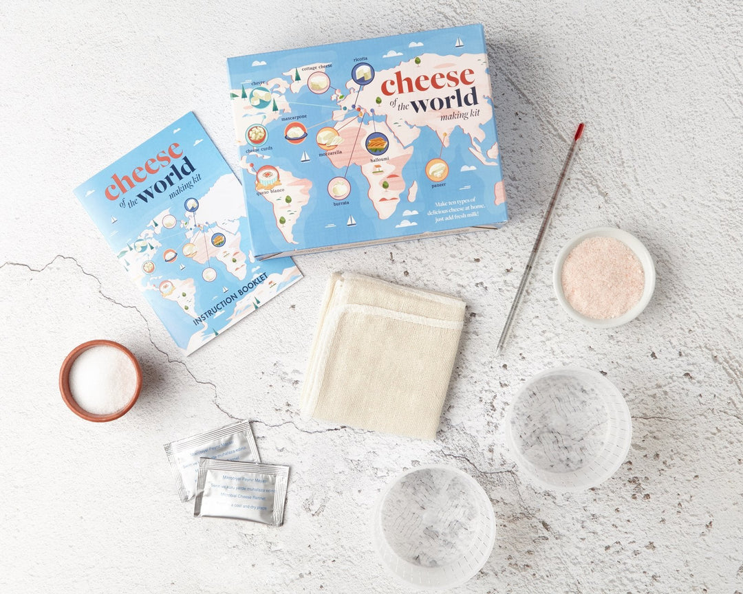 Cheese making kit gift with fresh homemade mozzarella, ricotta and burrata on a cheese board