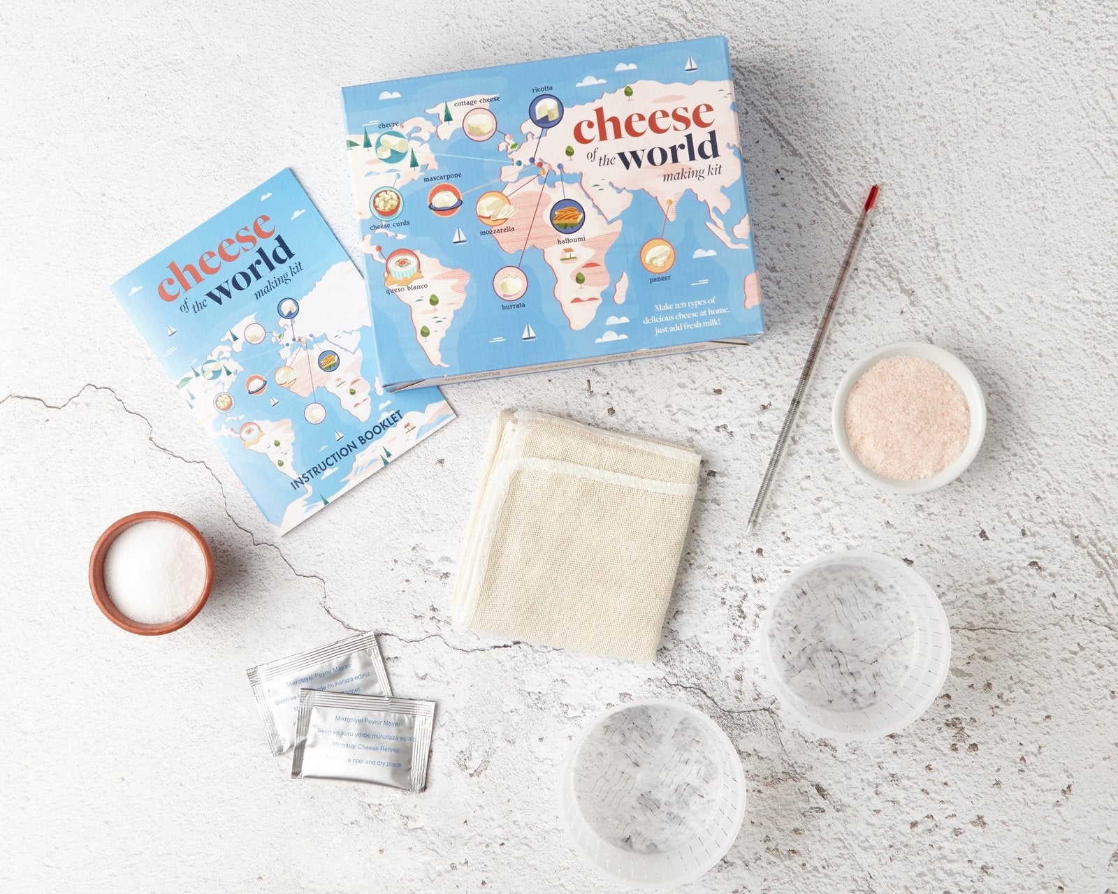 Cheese making kit gift with fresh homemade mozzarella, ricotta and burrata on a cheese board