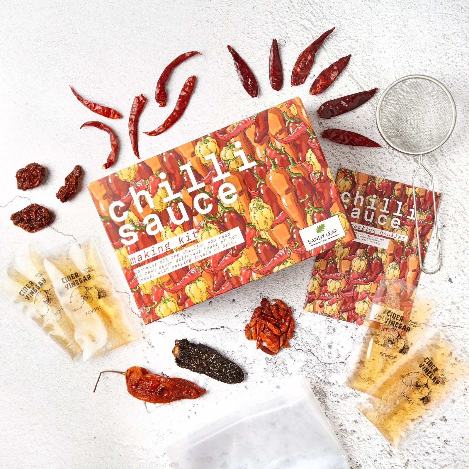 Learning how to make hot sauce at home with dried chillies, bottles and the Chilli Sauce Making Kit
